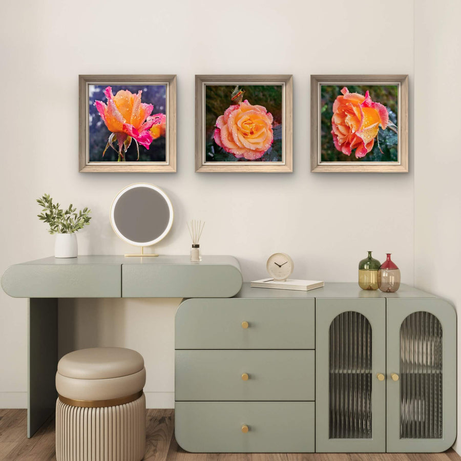 Decorative setup with a desk, mirror, and floral-themed rain-kissed rose wall art set of 3 in a room.